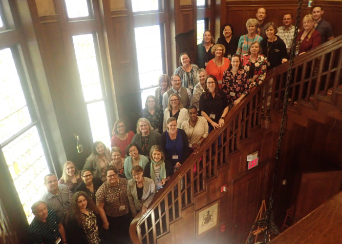 Group of Texas IPE Consortium Members Standing on a Staircase